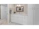 Bright bathroom features a modern vanity, marble countertops, and a tiled walk-in shower at 3062 Eastland Blvd # 402, Clearwater, FL 33761