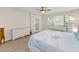 Bedroom featuring bright, natural light and beautiful wood-look floors and wicker furniture at 3062 Eastland Blvd # 402, Clearwater, FL 33761