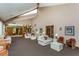Large community clubhouse featuring couches, chairs, and common area bookshelves at 3062 Eastland Blvd # 402, Clearwater, FL 33761