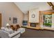 Community clubhouse featuring a fireplace, seating, and views of the exterior at 3062 Eastland Blvd # 402, Clearwater, FL 33761
