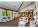 Open clubhouse with living and dining areas and large windows overlooking the pool at 3062 Eastland Blvd # 402, Clearwater, FL 33761
