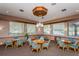Inviting common room with tables, chairs, and natural light at 3062 Eastland Blvd # 402, Clearwater, FL 33761