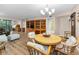 Open-concept dining area features wood floors, stylish furnishings, and access to modern amenities at 3062 Eastland Blvd # 402, Clearwater, FL 33761