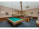 Spacious recreation room with a pool table, fitness equipment, and comfortable seating for entertainment at 3062 Eastland Blvd # 402, Clearwater, FL 33761