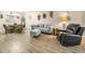 Comfortable living space featuring modern decor, hardwood flooring, and stylish furnishings for a relaxing atmosphere at 3062 Eastland Blvd # 402, Clearwater, FL 33761