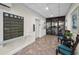 Indoor lobby area with mailboxes, elevator, seating and tile flooring at 3062 Eastland Blvd # 402, Clearwater, FL 33761
