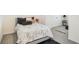 Tastefully decorated bedroom showcasing a comfortable bed, stylish accents, and a calming ambiance at 32803 Pez Landing Ln, Wesley Chapel, FL 33543