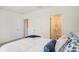 Bedroom featuring ensuite bathroom and walk in closet at 32803 Pez Landing Ln, Wesley Chapel, FL 33543