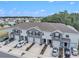 Well-maintained townhome exteriors with garages, driveways, and landscaping in a suburban community at 32803 Pez Landing Ln, Wesley Chapel, FL 33543
