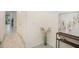 Inviting foyer features neutral paint colors, tile floors, decorative rug and console table with decor at 32803 Pez Landing Ln, Wesley Chapel, FL 33543