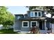 Charming two-story home showcasing a gray exterior with white trim, complemented by lush landscaping and a welcoming front entrance at 336 9Th Ne Ave, St Petersburg, FL 33701