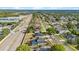 Aerial shot of a vibrant neighborhood, showcasing the house and community layout at 3434 St Ives Blvd, Spring Hill, FL 34609