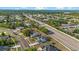 Neighborhood aerial view of the houses, road, and community, taken on a sunny day at 3434 St Ives Blvd, Spring Hill, FL 34609