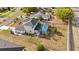 Aerial view of the home showcasing the screened pool, patio area, and fully fenced backyard at 3434 St Ives Blvd, Spring Hill, FL 34609