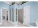 Bathroom showcasing a modern design with walk in shower and blue walls at 3434 St Ives Blvd, Spring Hill, FL 34609