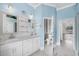 Bathroom with double sinks, vanity, and views to pool at 3434 St Ives Blvd, Spring Hill, FL 34609