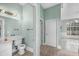 Well-lit bathroom with adjacent rooms visible, connecting functionality with open-concept living at 3434 St Ives Blvd, Spring Hill, FL 34609