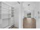 Bedroom with walk-in closet and view of pool at 3434 St Ives Blvd, Spring Hill, FL 34609