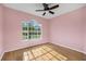 Bright bedroom with hardwood floors and a large window, offering ample natural light at 3434 St Ives Blvd, Spring Hill, FL 34609