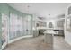 Inviting kitchen with an island, stainless steel appliances, and ample natural light at 3434 St Ives Blvd, Spring Hill, FL 34609