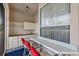 Outdoor kitchen with bar seating, sink, cabinetry, and large window at 3434 St Ives Blvd, Spring Hill, FL 34609