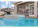 Backyard pool includes hot tub and outdoor kitchen at 3434 St Ives Blvd, Spring Hill, FL 34609