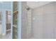 Shower with glass block accent wall and built in shelving at 3434 St Ives Blvd, Spring Hill, FL 34609
