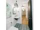Stylish bathroom featuring a black-trimmed window, subway tile and eye-catching tile floor at 3501 W Tacon St, Tampa, FL 33629