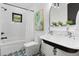 Stylish bathroom featuring a black-trimmed window, subway tile and eye-catching tile floor at 3501 W Tacon St, Tampa, FL 33629
