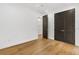 Bright bedroom with hardwood floors, modern trim, and a ceiling fan at 3501 W Tacon St, Tampa, FL 33629