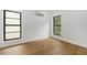 Bright bedroom featuring hardwood floors, large windows, and natural light at 3501 W Tacon St, Tampa, FL 33629