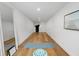 Versatile bonus room with hardwood floors, a yoga mat, and ample natural light; perfect for a home gym or studio at 3501 W Tacon St, Tampa, FL 33629