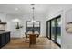 Bright dining room with modern lighting, and sliding glass doors overlooking backyard at 3501 W Tacon St, Tampa, FL 33629