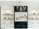 Close-up of fireplace with floating shelves and a decorative mantle and cabinetry at 3501 W Tacon St, Tampa, FL 33629