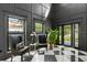 Elegant foyer with black and white checkered floors, statement walls, and a view to the front yard at 3501 W Tacon St, Tampa, FL 33629