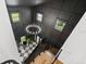 High-ceiling foyer boasts a statement chandelier, black accent walls, and staircase with wooden treads at 3501 W Tacon St, Tampa, FL 33629