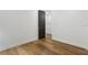 Clean hallway with hardwood floors and fresh decor, and views into a decorated hall at 3501 W Tacon St, Tampa, FL 33629