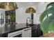 Kitchen island featuring stainless steel appliances, pendant lighting, and granite counters at 3501 W Tacon St, Tampa, FL 33629