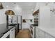 White gourmet kitchen featuring stainless appliances and lots of cabinet space at 3501 W Tacon St, Tampa, FL 33629