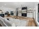 Bright living room featuring modern finishes, sleek fireplace, and hardwood flooring at 3501 W Tacon St, Tampa, FL 33629