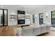 Bright living room features hardwood floors, recessed lighting, and an electric fireplace at 3501 W Tacon St, Tampa, FL 33629
