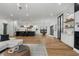 Open concept space featuring living room, kitchen, and dining area with hardwood floors at 3501 W Tacon St, Tampa, FL 33629