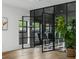 Living space featuring a decorative glass paneled wall and checkered tile accent at 3501 W Tacon St, Tampa, FL 33629
