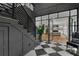 View of the entryway featuring a modern staircase and glass doors leading to the living room at 3501 W Tacon St, Tampa, FL 33629