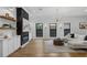 Open living room showcasing fireplace, modern lighting, and neutral decor at 3501 W Tacon St, Tampa, FL 33629