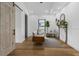 Bright living room featuring hardwood floors, stylish furniture, and charming vintage fireplace at 3501 W Tacon St, Tampa, FL 33629
