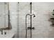 Bright shower features a vintage-inspired shower head and subway tile walls at 3501 W Tacon St, Tampa, FL 33629