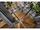 Modern staircase with black railing and light wood steps at 3501 W Tacon St, Tampa, FL 33629