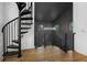 Unique staircase features a spiral staircase, chandelier, and wood flooring at 3501 W Tacon St, Tampa, FL 33629