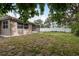 The backyard features a spacious lawn and a privacy fence, offering a secluded outdoor space at 3601 Grayton Dr, New Port Richey, FL 34652